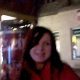 A drunk brunette girl is video-recorded taking a piss in a public location at night.